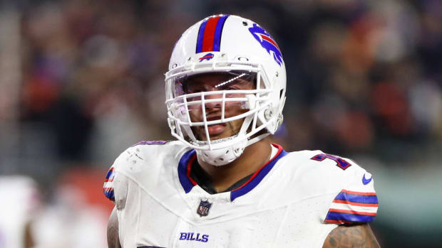 Bills left tackle Dion Dawkins runs off the field at halftime.